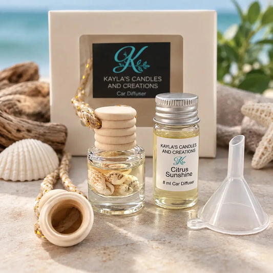 Hanging car diffuser by Kayla's Candles & Creations, featuring a glass fragrance bottle with wooden cap, seashell accents, 8ml refill oil and funnel